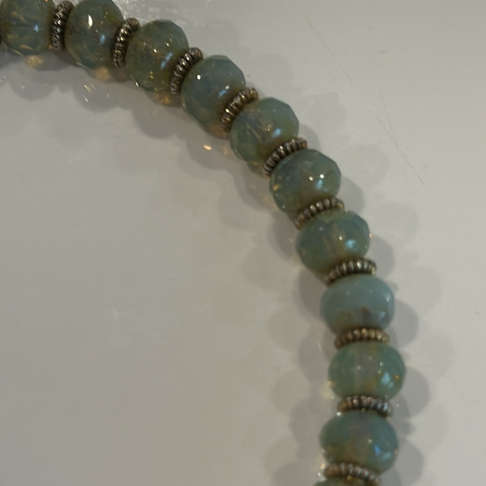 7.5-inch Artisan gemstone bracelet with gold lotus flower charm.